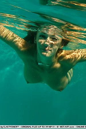 Playful chick Radka B spreads her legs and shows her snatch under water