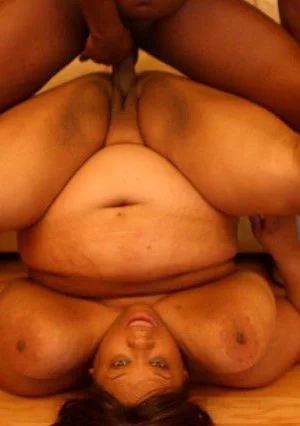 Plump dark skinned lady Chocolate Nights gives a smile before taking dick in her fuck hole