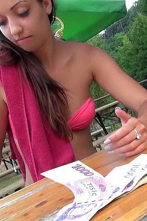 Sexy looking brunette with tanned body Casey Jordan exposes her boobs for the cam