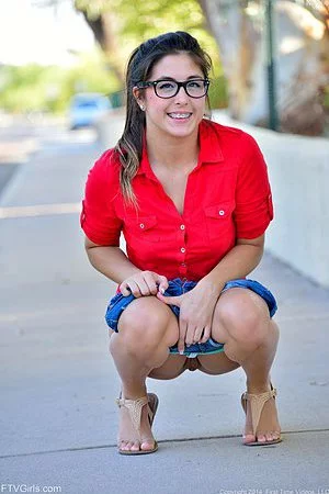 Latina teen Natalie Monroe takes her shorts off in an outdoor tease session on the streets.