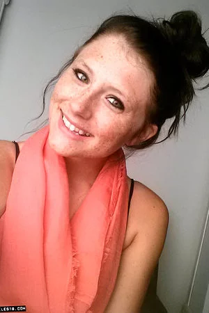 Freckles is a brunette babe who likes to pose and tease in her see through panties.