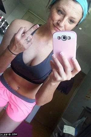 Sexy brunette Freckles takes some racy pictures after a workout gets her soaked.