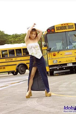 Exciting Japanese student babe Yuri Idols is getting undressed and hotly posing in the school bus