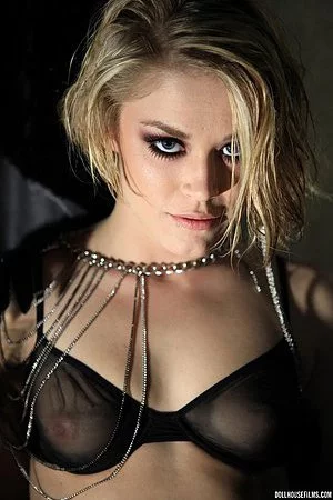 Gothic blonde Ash Hollywood appears in photographic art in lingerie while testing her deep throat.