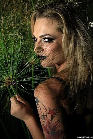 Otherwise boring photographic art gets spiced up with blonde goth girl Bailey Blue and her ass.