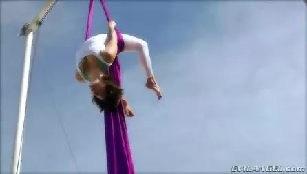 Hot brunette Bella Donna is showing some really exciting exercises outdoor