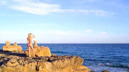 Hot blonde Sylvie Sinner is on the sea shore giving the naked body to hot sun