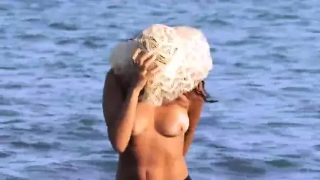 The pretty brunette chick Chiara Femjoy is walking naked in the sea water