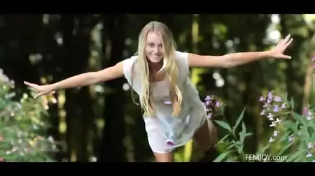 The playful blonde doll Carisha Femjoy strips and walking nude along the railroad