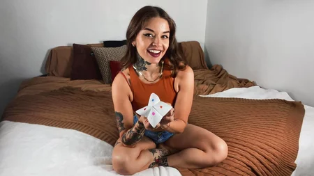 Inked cutie Vanessa Vega plays with a black toy in bed