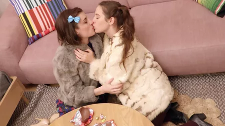 Young lesbians Willow A and Lucy Q make love on the couch
