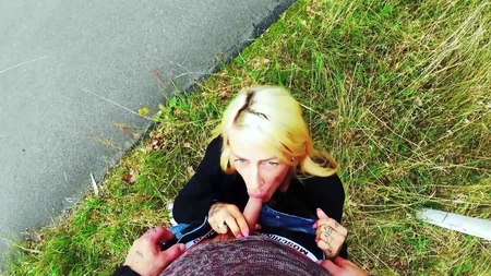 Tattooed blonde chick pleasuring horny stud in a public park